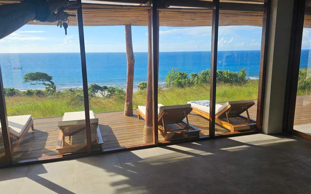 Ocean terrace with loungers on a finished villa